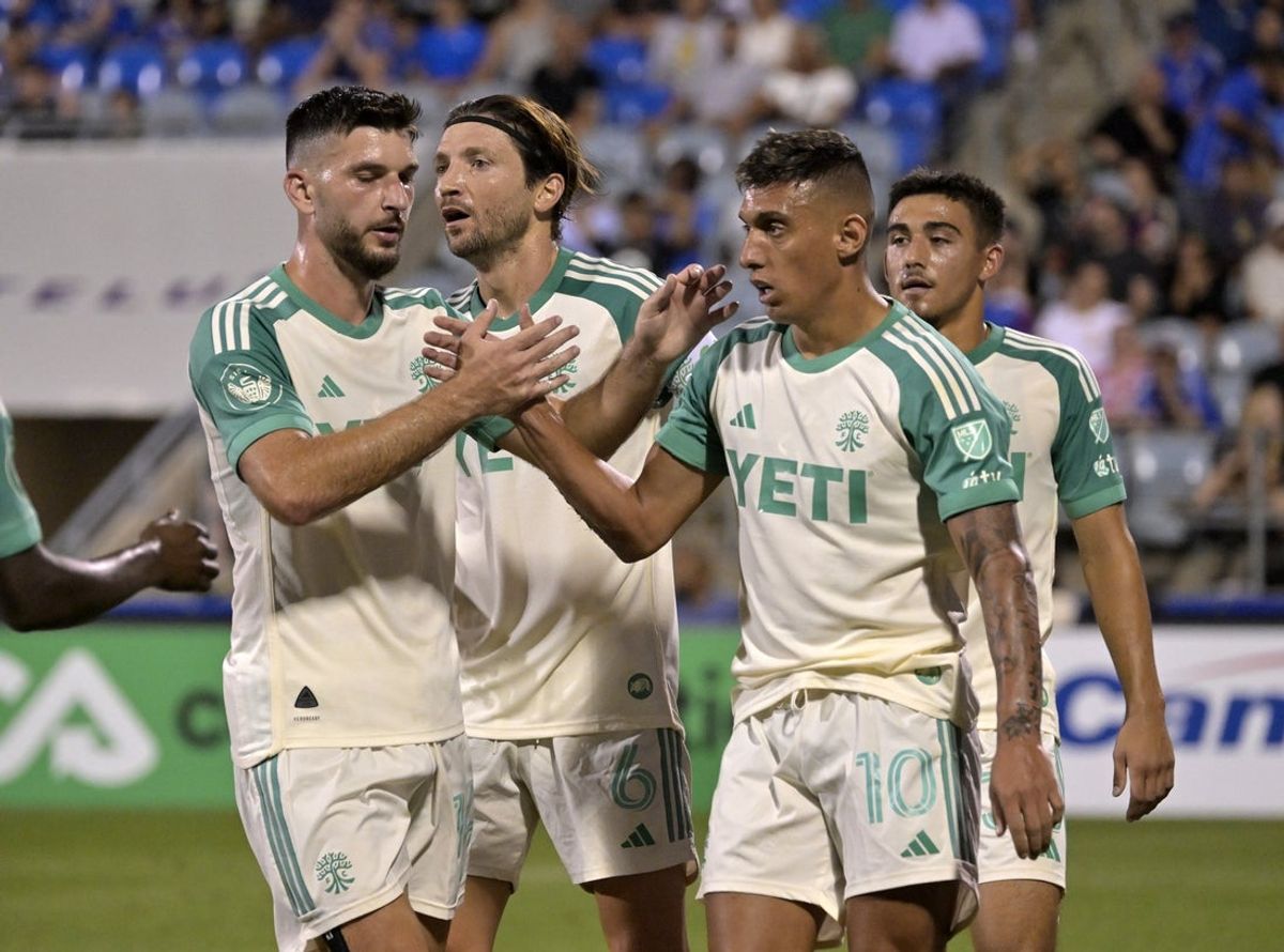 Aug 23, 2025; Montreal, Province of Quebec, CAN; Austin FC forward Myrto Uzuni (10) celebrates with teammates after scoring a goal against CF Montreal during the first half at Saputo Stadium. Mandatory Credit: Eric Bolte-Imagn Images