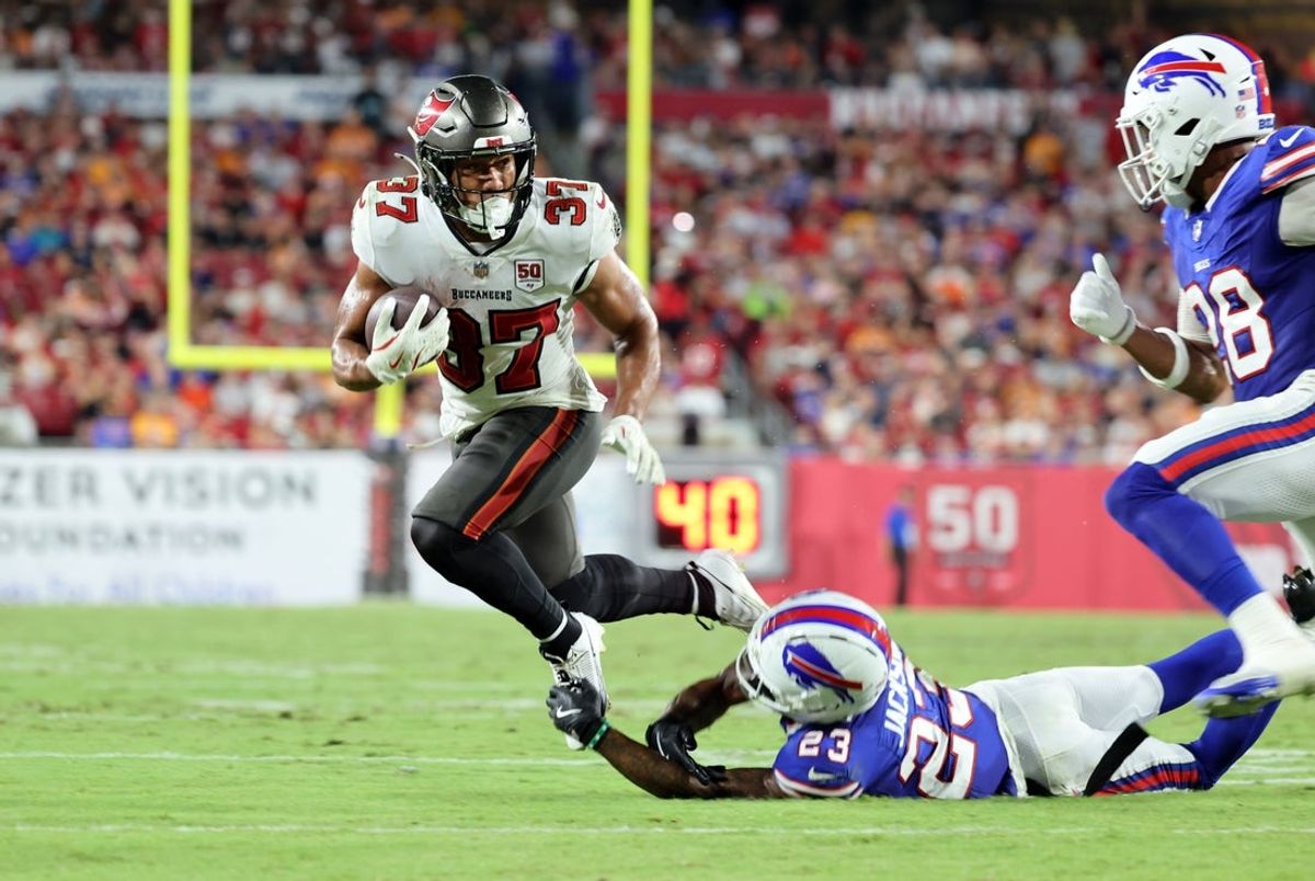 Aug 23, 2025; Tampa, Florida, USA; Tampa Bay Buccaneers running back Josh Williams (37) runs with the ball as Buffalo Bills cornerback Dane Jackson (23) tackles during the second quarter at Raymond James Stadium. Mandatory Credit: Kim Klement Neitzel-Imagn Images