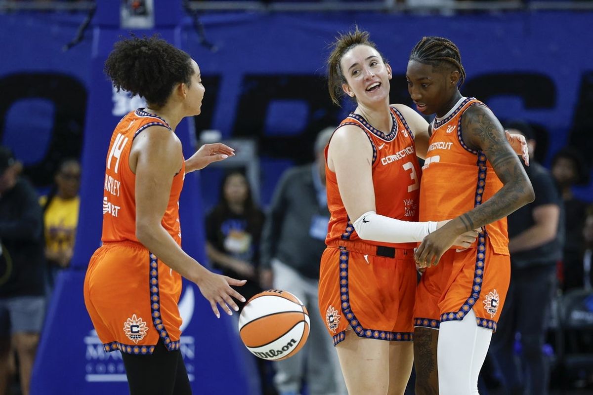 Aug 23, 2025; Chicago, Illinois, USA; Connecticut Sun guard Marina Mabrey (3) celebrates with guard Saniya Rivers (22) and guard Bria Hartley (14) teams win against the Chicago Sky in a WNBA game at Wintrust Arena. Mandatory Credit: Kamil Krzaczynski-Imagn Images
