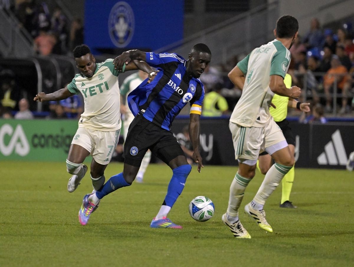 Aug 23, 2025; Montreal, Province of Quebec, CAN; CF Montreal forward Prince Owusu (9) plays the ball and Austin FC forward Jader Obrian (7) defends during the second half at Saputo Stadium. Mandatory Credit: Eric Bolte-Imagn Images
