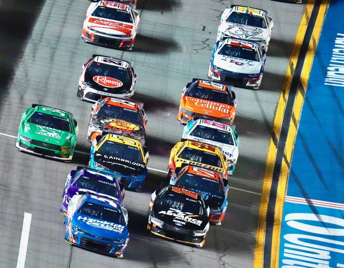 Kyle Larson (5) wins Stage 1 of the Coke Zero Sugar 400 NASCAR Cup Series race, Saturday, Aug. 23, 2025, at Daytona International Speedway.