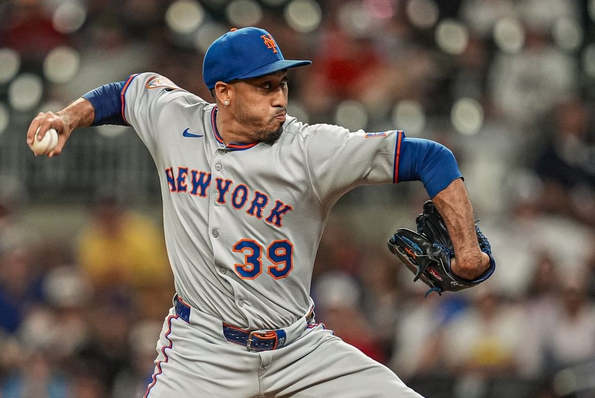 Aug 23, 2025; Cumberland, Georgia, USA; New York Mets relief pitcher Edwin Diaz (39) pitches against the Atlanta Braves during the ninth inning at Truist Park. Mandatory Credit: Dale Zanine-Imagn Images