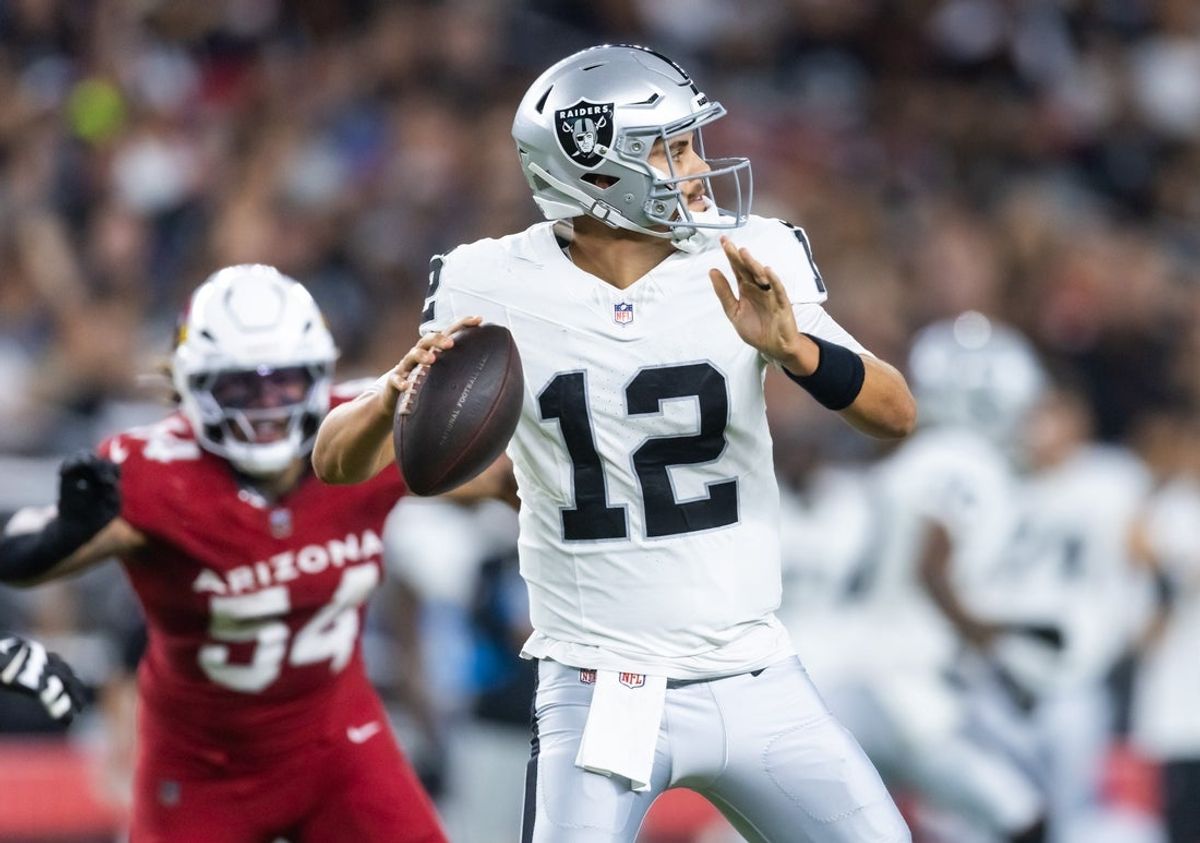 Aug 23, 2025; Glendale, Arizona, USA; Las Vegas Raiders quarterback Aidan O'Connell (12) against the Arizona Cardinals during a preseason NFL game at State Farm Stadium. Mandatory Credit: Mark J. Rebilas-Imagn Images