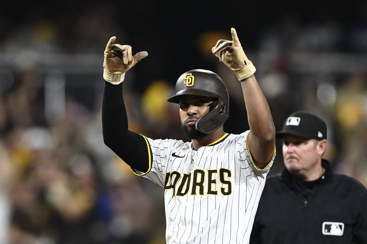 Aug 23, 2025; San Diego, California, USA; San Diego Padres shortstop Xander Bogaerts (2) celebrates after hitting an RBI double during the eighth inning against the Los Angeles Dodgers at Petco Park. Mandatory Credit: Denis Poroy-Imagn Images