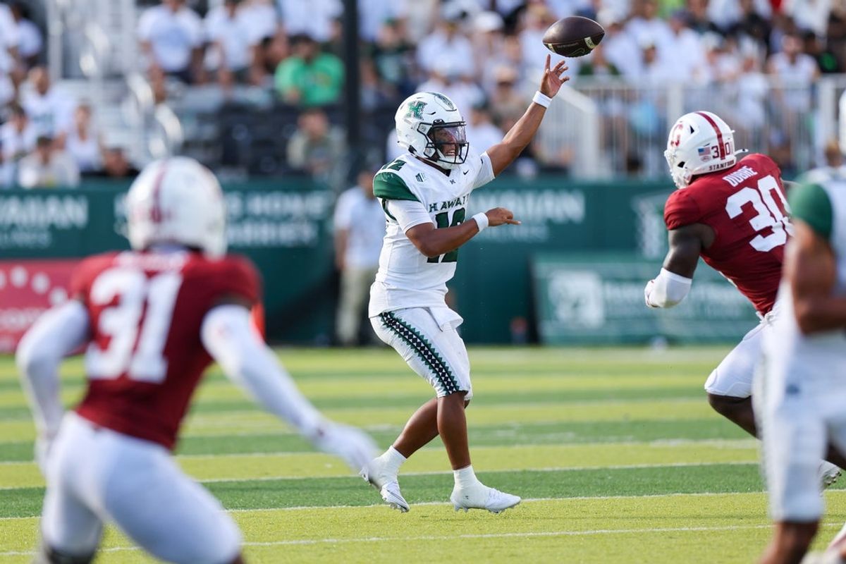 Aug 23, 2025; Honolulu, Hawaii, USA;  Hawaii Rainbow Warriors quarterback Micah Alejado (12) makes a pass over the Stanford Cardinal during the second half at Clarence T.C. Ching Athletics Complex. Mandatory Credit: Marco Garcia-Imagn Images
