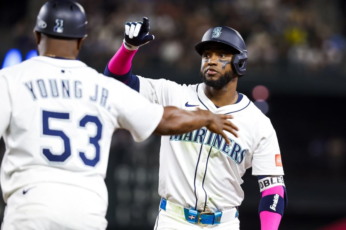 Aug 23, 2025; Seattle, Washington, USA; Seattle Mariners right fielder Victor Robles (10) reacts after hitting a single against the Athletics during the seventh inning at T-Mobile Park. Mandatory Credit: Joe Nicholson-Imagn Images