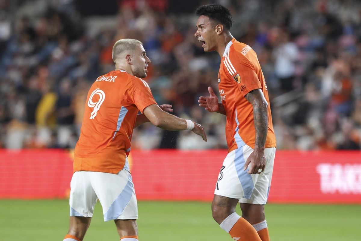Aug 23, 2025; Houston, Texas, USA; Houston Dynamo FC defender Antonio Carlos (3) celebrates with midfielder Ondrej Lingr (9) after scroing a goal during the second half against the San Jose Earthquakes at Shell Energy Stadium. Mandatory Credit: Troy Taormina-Imagn Images