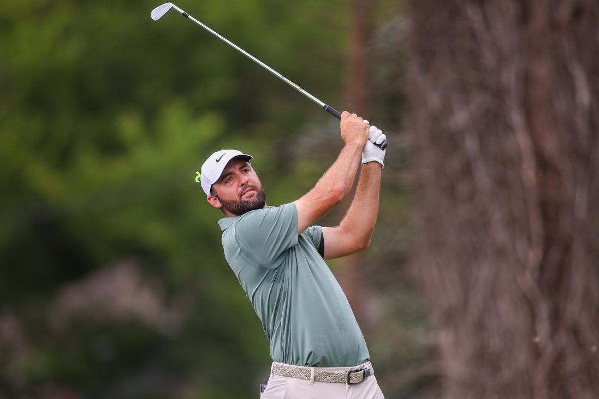Aug 24, 2025; Atlanta, Georgia, USA; Scottie Scheffler plays his shot from the second tee during the final round of the TOUR Championship golf tournament. Mandatory Credit: Brett Davis-Imagn Images