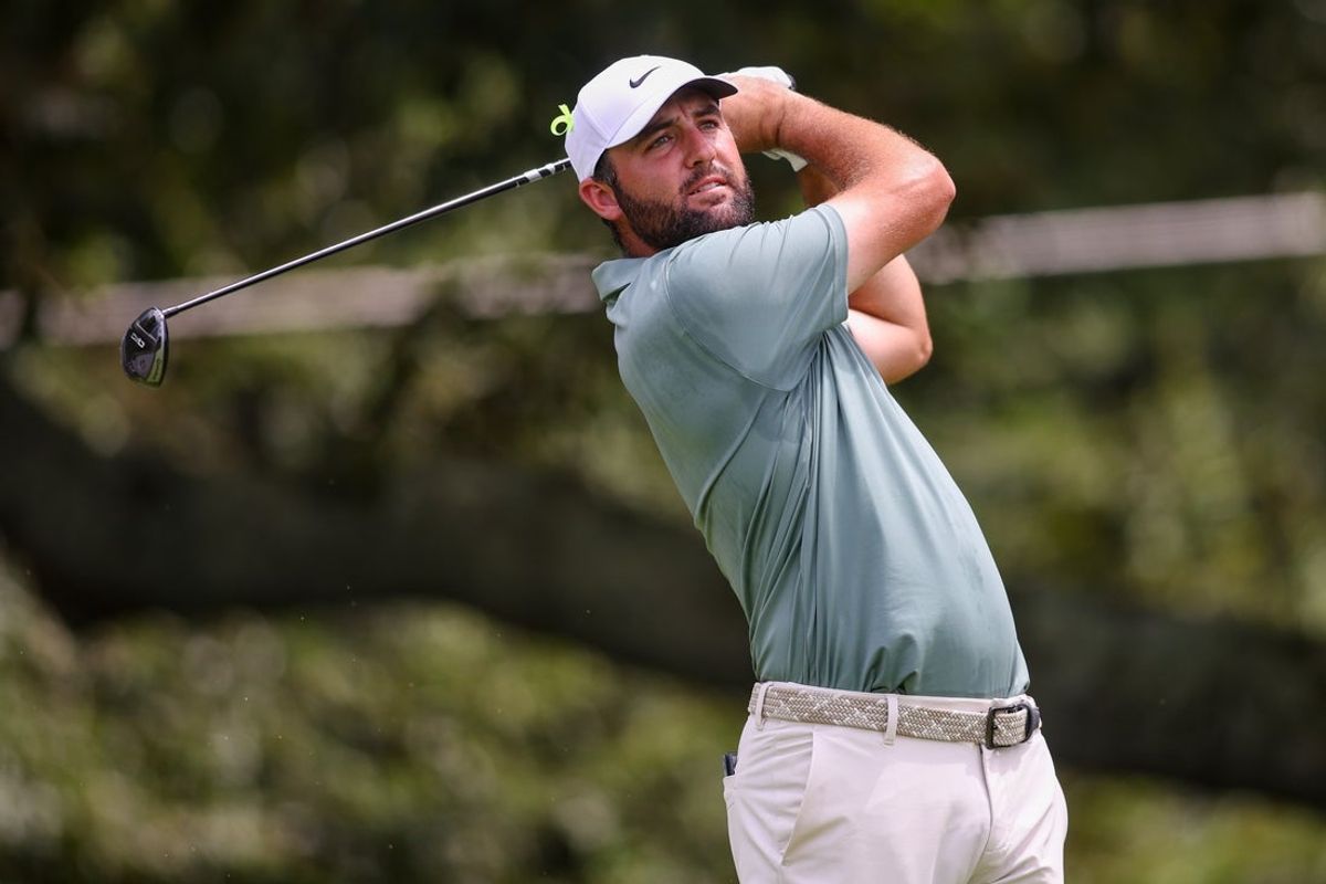 Aug 24, 2025; Atlanta, Georgia, USA; Scottie Scheffler plays his shot from the third tee during the final round of the TOUR Championship golf tournament. Mandatory Credit: Brett Davis-Imagn Images