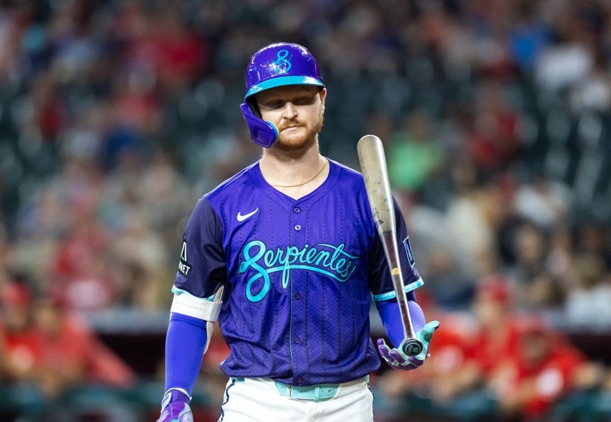 Aug 24, 2025; Phoenix, Arizona, USA; Arizona Diamondbacks first baseman Pavin Smith tosses his bat after striking out in the first inning against the Cincinnati Reds at Chase Field. Mandatory Credit: Mark J. Rebilas-Imagn Images