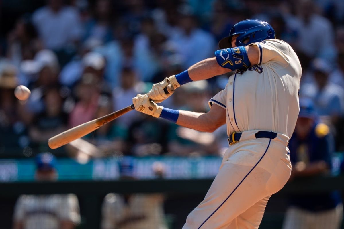 Aug 24, 2025; Seattle, Washington, USA; Seattle Mariners catcher Cal Raleigh (29) hits a two-run home run during the first inning against the Athletics at T-Mobile Park. Mandatory Credit: Stephen Brashear-Imagn Images
