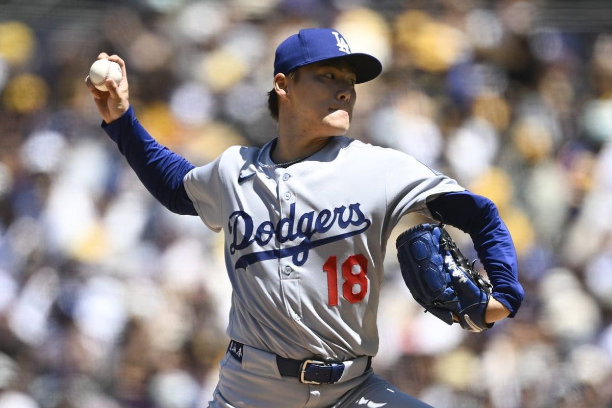 Aug 24, 2025; San Diego, California, USA; Los Angeles Dodgers starting pitcher Yoshinobu Yamamoto (18) delivers during the first inning against the San Diego Padres at Petco Park. Mandatory Credit: Denis Poroy-Imagn Images