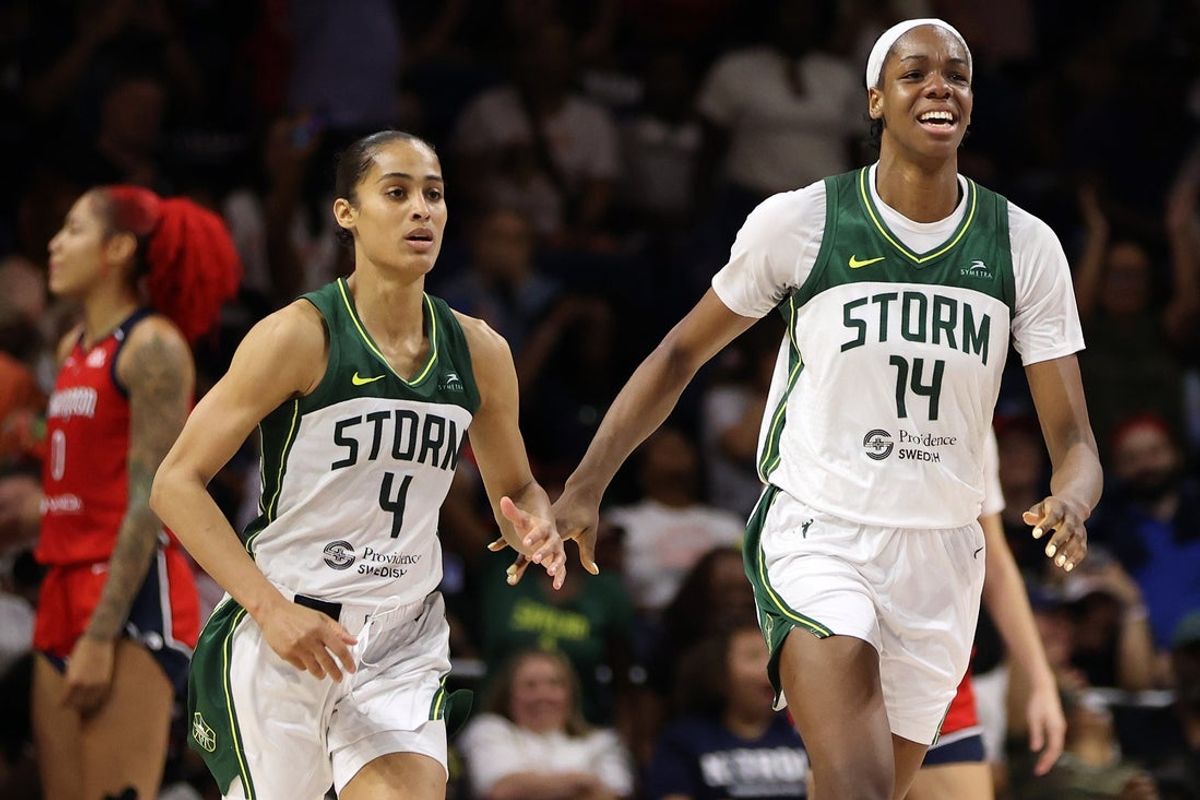 Aug 24, 2025; Washington, District of Columbia, USA; Seattle Storm center Dominique Malonga (14) celebrates with Seattle Storm guard Skylar Diggins (4) during the second half against the Washington Mystics at CareFirst Arena. Mandatory Credit: Daniel Kucin Jr.-Imagn Images