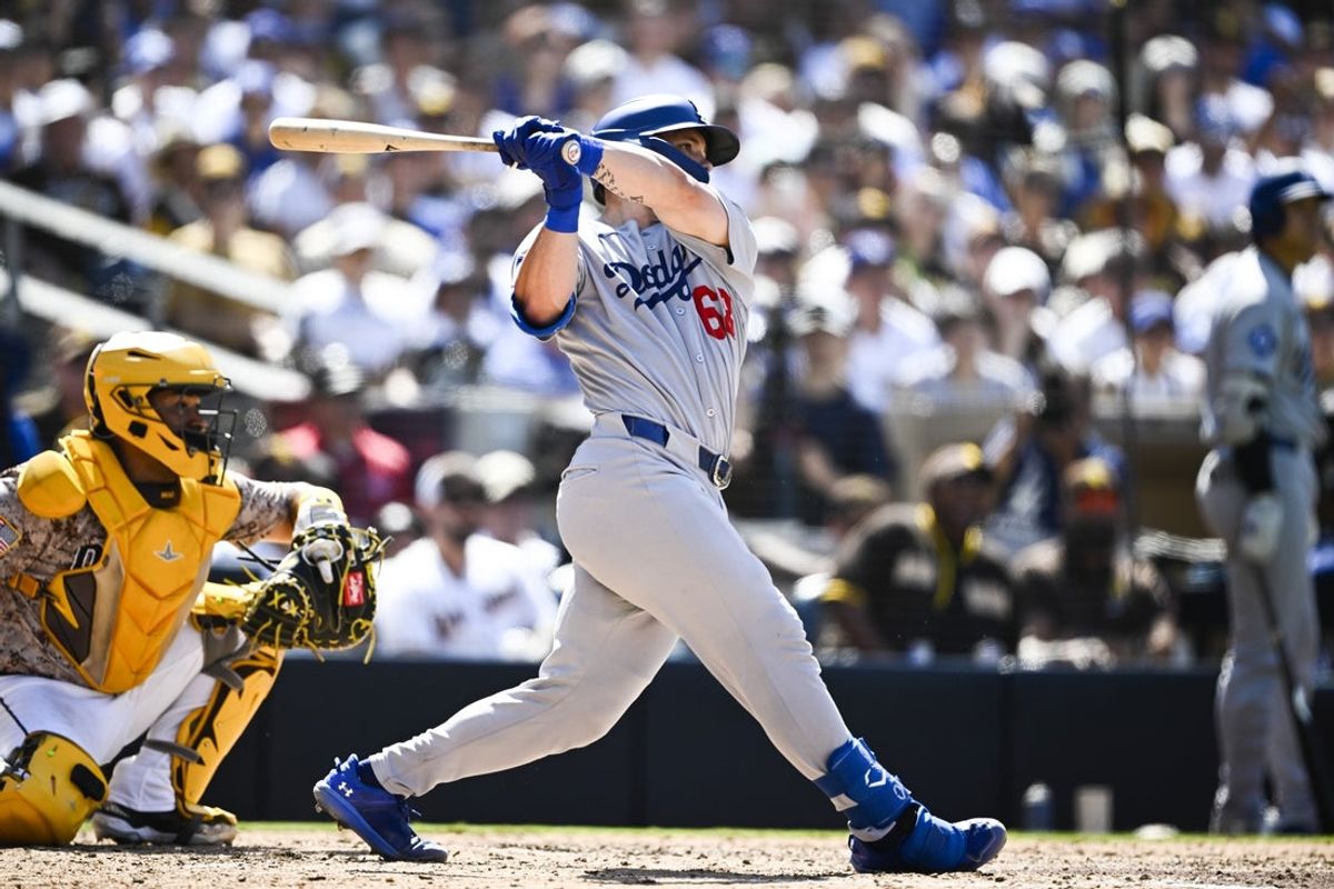 Aug 24, 2025; San Diego, California, USA; Los Angeles Dodgers catcher Dalton Rushing (68) hits a three-run home run during the seventh inning against the San Diego Padres at Petco Park. Mandatory Credit: Denis Poroy-Imagn Images