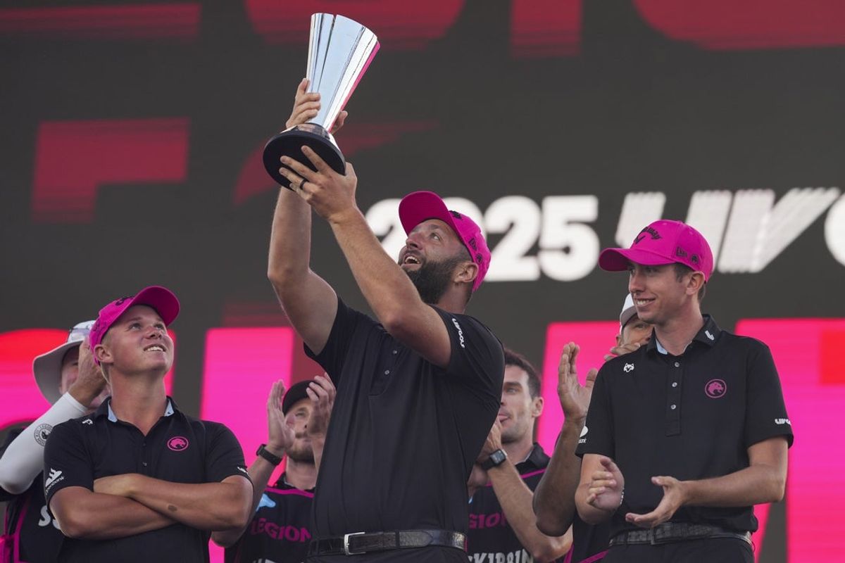 Aug 24, 2025; Detroit, Michigan, USA; Jon Rahm and teammates of Legion XIII celebrate with the trophy after the finals of the LIV Golf Michigan Team Championship at The Cardinal at Saint John's Resort. Mandatory Credit: Aaron Doster-Imagn Images