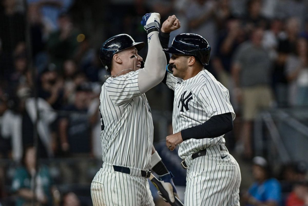 Aug 24, 2025; Bronx, New York, USA; New York Yankees outfielder Trent Grisham (12) celebrates with outfielder Aaron Judge (99) after hitting a solo home run against the Boston Red Sox during the third inning at Yankee Stadium. Mandatory Credit: John Jones-Imagn Images