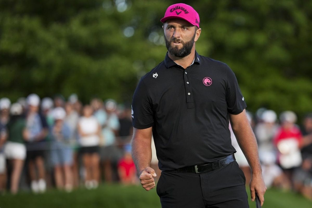 Aug 24, 2025; Detroit, Michigan, USA; Jon Rahm of Legion XIII reacts to making his putt on the 18th green in a playoff hole during the finals of the LIV Golf Michigan Team Championship at The Cardinal at Saint John's Resort. Mandatory Credit: Aaron Doster-Imagn Images
