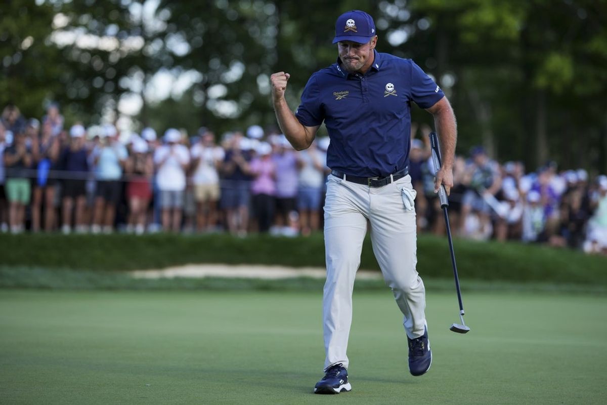 Aug 24, 2025; Detroit, Michigan, USA; Bryson DeChambeau of Crushers GC reacts to making his putt on the 18th green in a playoff hole during the finals of the LIV Golf Michigan Team Championship at The Cardinal at Saint John's Resort. Mandatory Credit: Aaron Doster-Imagn Images