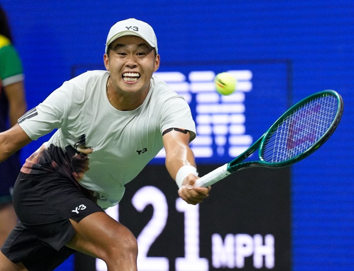 Aug 24, 2025; Flushing, NY, USA;  Learner Tien (USA) hits to Novak Djokovic (SRB) on day one of the 2025 U.S. Open tennis tournament at the USTA Billie Jean King National Tennis Center. Mandatory Credit: Robert Deutsch-Imagn Images