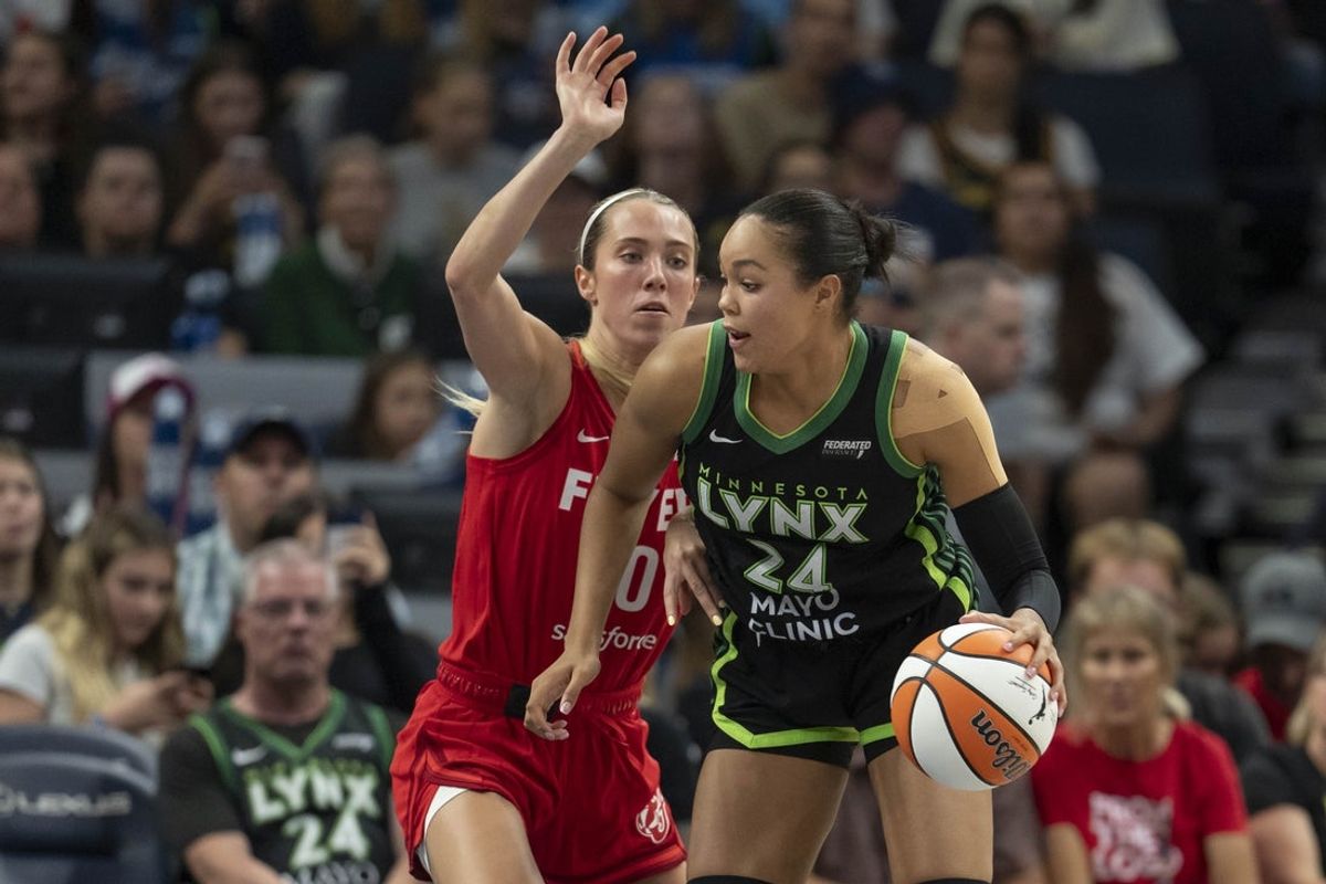 Aug 24, 2025; Minneapolis, Minnesota, USA; Minnesota Lynx forward Napheesa Collier (24) drives to the basket past Indiana Fever guard Lexie Hull (10) in the second half at Target Center. Mandatory Credit: Jesse Johnson-Imagn Images