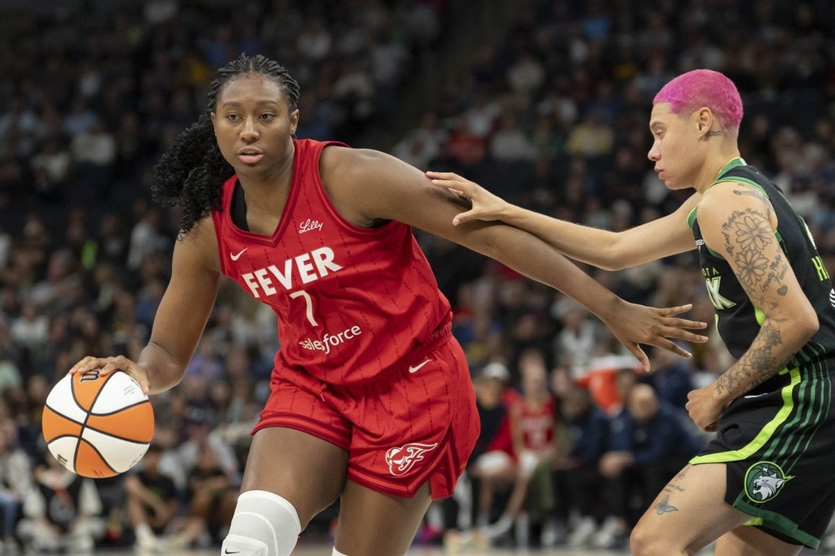 Aug 24, 2025; Minneapolis, Minnesota, USA; Indiana Fever forward Aliyah Boston (7) drives to the basket past Minnesota Lynx guard Natisha Hiedeman (2) in the second half at Target Center. Mandatory Credit: Jesse Johnson-Imagn Images