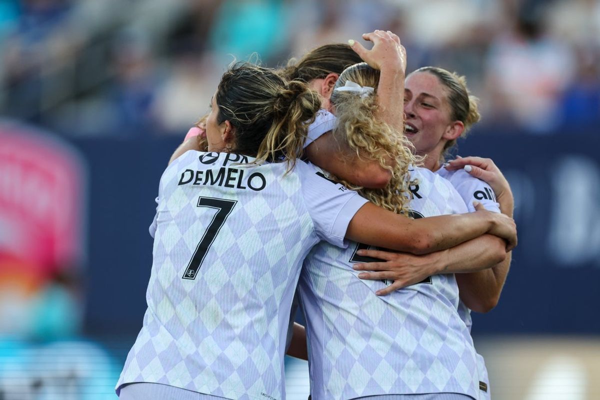 Aug 24, 2025; San Diego, California, USA; Racing Louisville FC teammates celebrate forward Emma Sears (13) second half goal against San Diego Wave FC at Snapdragon Stadium. Mandatory Credit: Chadd Cady-Imagn Images