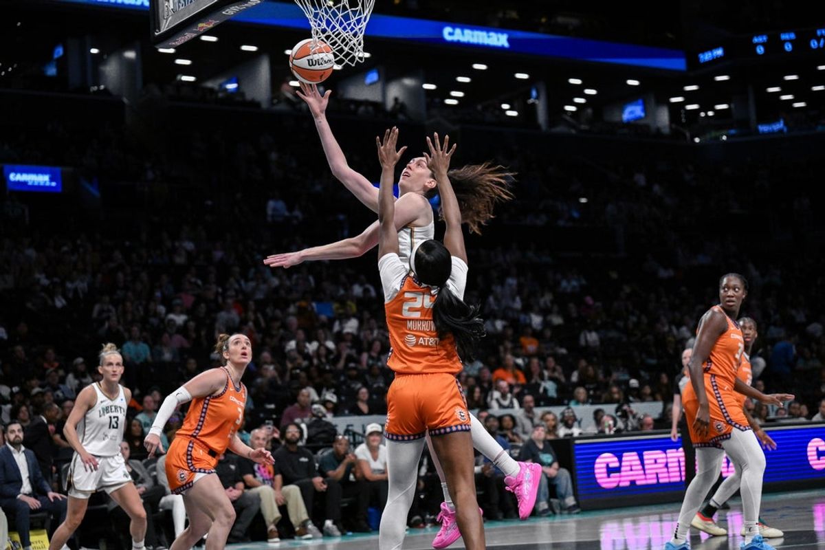 Aug 25, 2025; Brooklyn, New York, USA; New York Liberty forward Breanna Stewart (30) shoots the ball while defended by Connecticut Sun forward Aneesah Morrow (24) during the first half at Barclays Center. Mandatory Credit: John Jones-Imagn Images