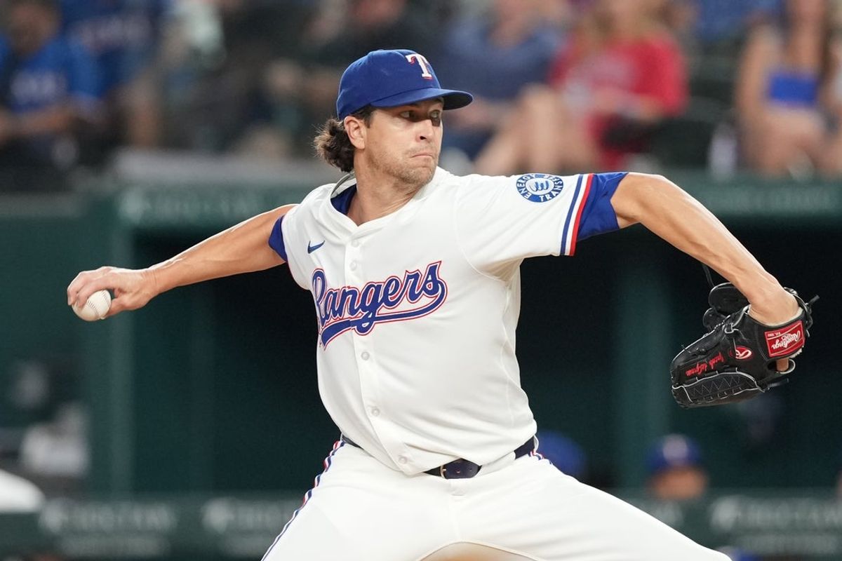 Aug 25, 2025; Arlington, Texas, USA; Texas Rangers starting pitcher Jacob deGrom (48) delivers a pitch to the Los Angeles Angels during the second inning at Globe Life Field. Mandatory Credit: Jim Cowsert-Imagn Images