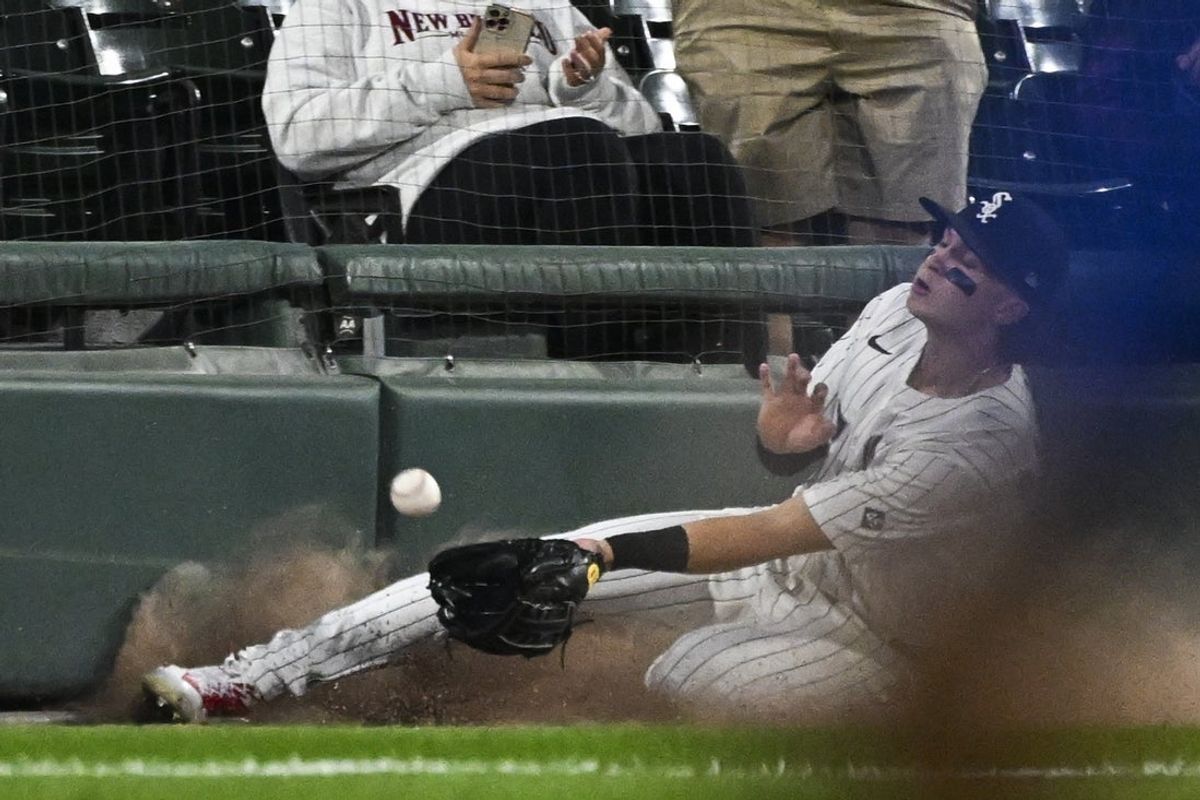 Aug 25, 2025; Chicago, Illinois, USA;  Chicago White Sox outfielder Brooks Baldwin (27) catches the foul ball hit by Kansas City Royals second base Adam Frazier (not shown) during the fifth inning at Rate Field. Mandatory Credit: Matt Marton-Imagn Images