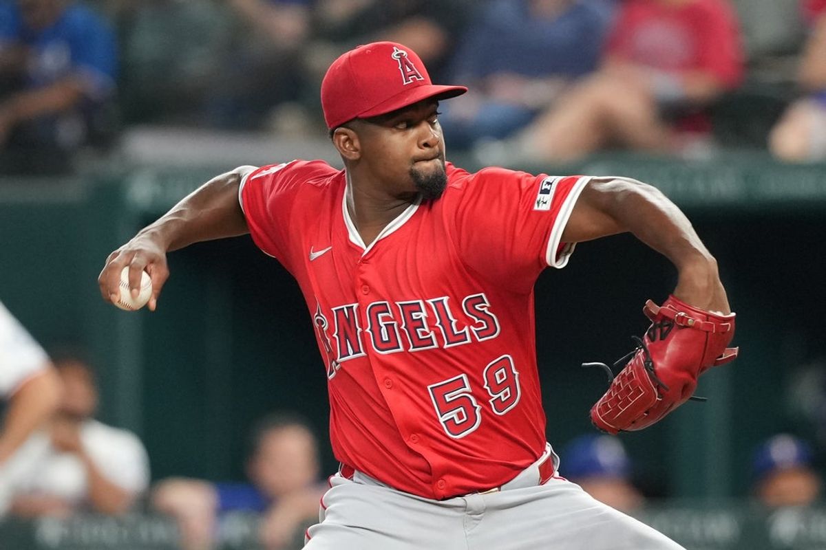 Aug 25, 2025; Arlington, Texas, USA; Los Angeles Angels starting pitcher Jose Soriano (59) delivers a pitch to the Texas Rangers during the third inning at Globe Life Field. Mandatory Credit: Jim Cowsert-Imagn Images