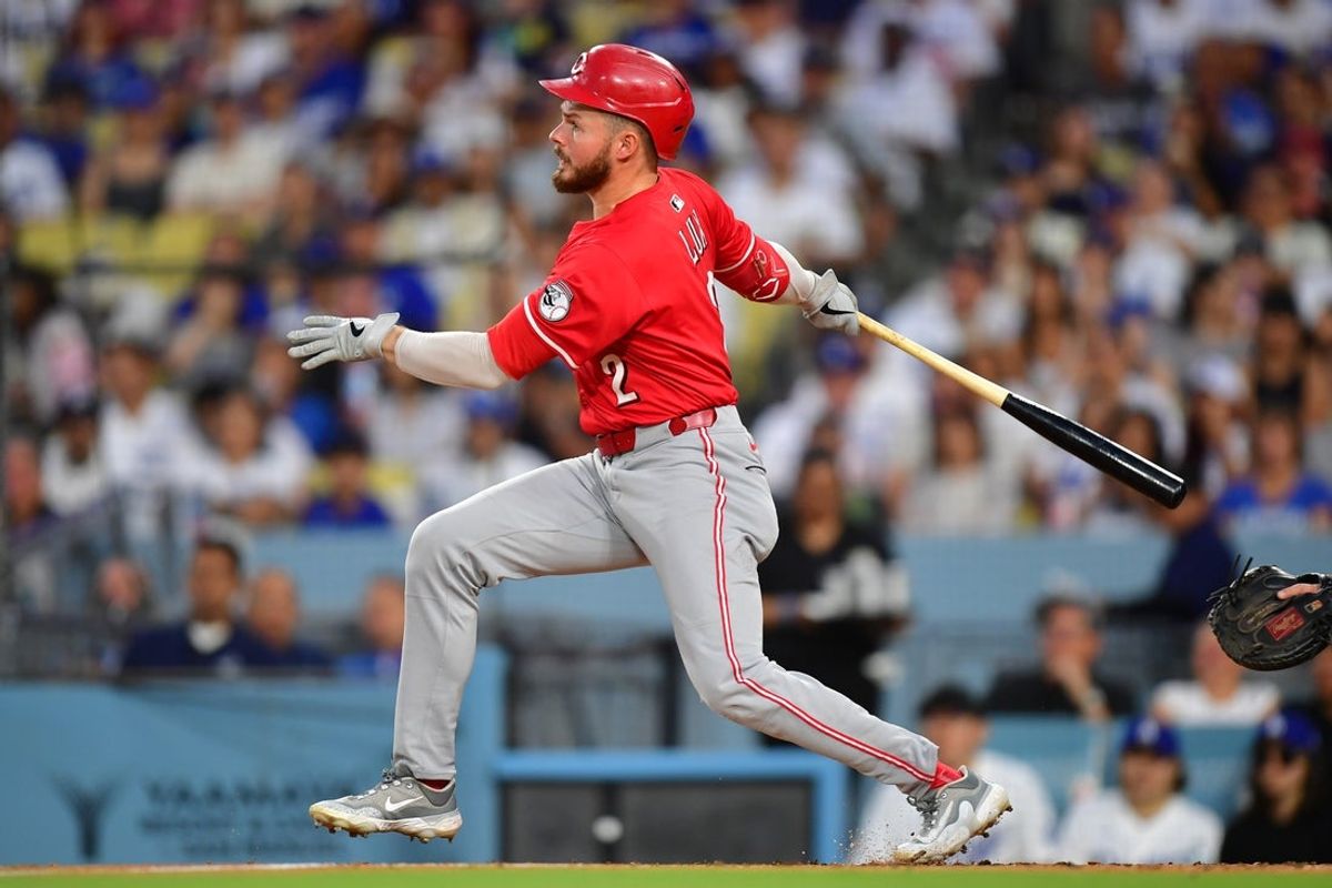 Aug 25, 2025; Los Angeles, California, USA; Cincinnati Reds outfielder Gavin Lux (2) hits a double against the Los Angeles Dodgers in the second inning at Dodger Stadium. Mandatory Credit: Gary A. Vasquez-Imagn Images
