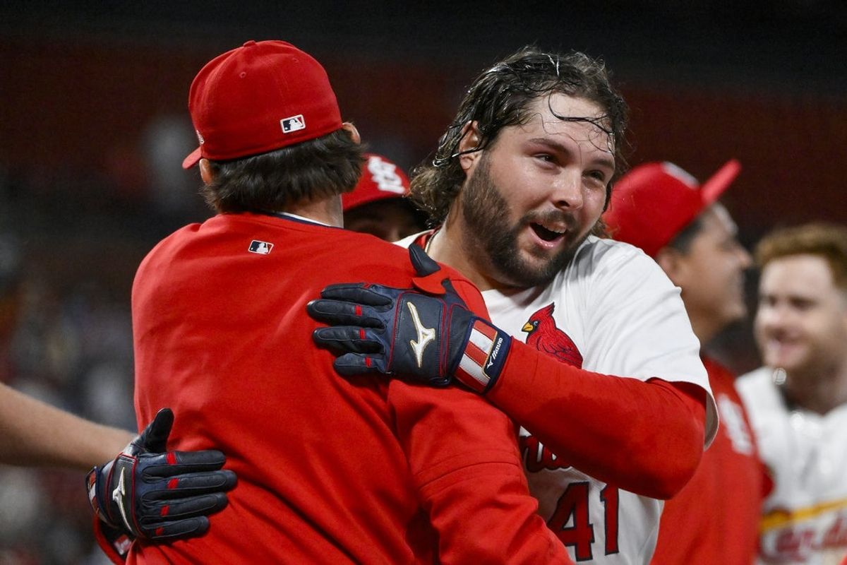 Aug 25, 2025; St. Louis, Missouri, USA;  St. Louis Cardinals first baseman Alec Burleson (41) celebrates with teammates after hitting a walk-off solo home run against the Pittsburgh Pirates during the ninth inning at Busch Stadium. Mandatory Credit: Jeff Curry-Imagn Images