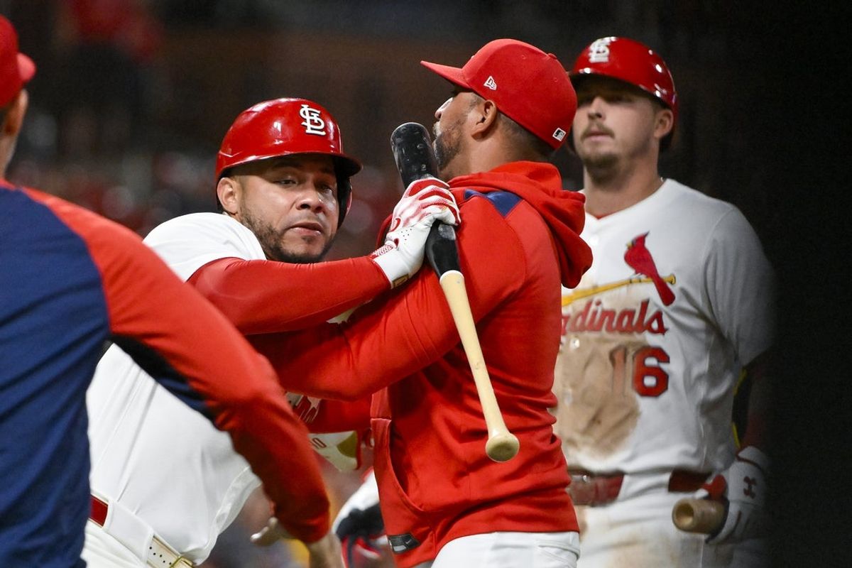 Aug 25, 2025; St. Louis, Missouri, USA;  St. Louis Cardinals designated hitter Willson Contreras (40) is held back by manager Oliver Marmol (37) after he was ejected by umpire Derek Thomas (not pictured) during the seventh inning against the Pittsburgh Pirates at Busch Stadium. Mandatory Credit: Jeff Curry-Imagn Images