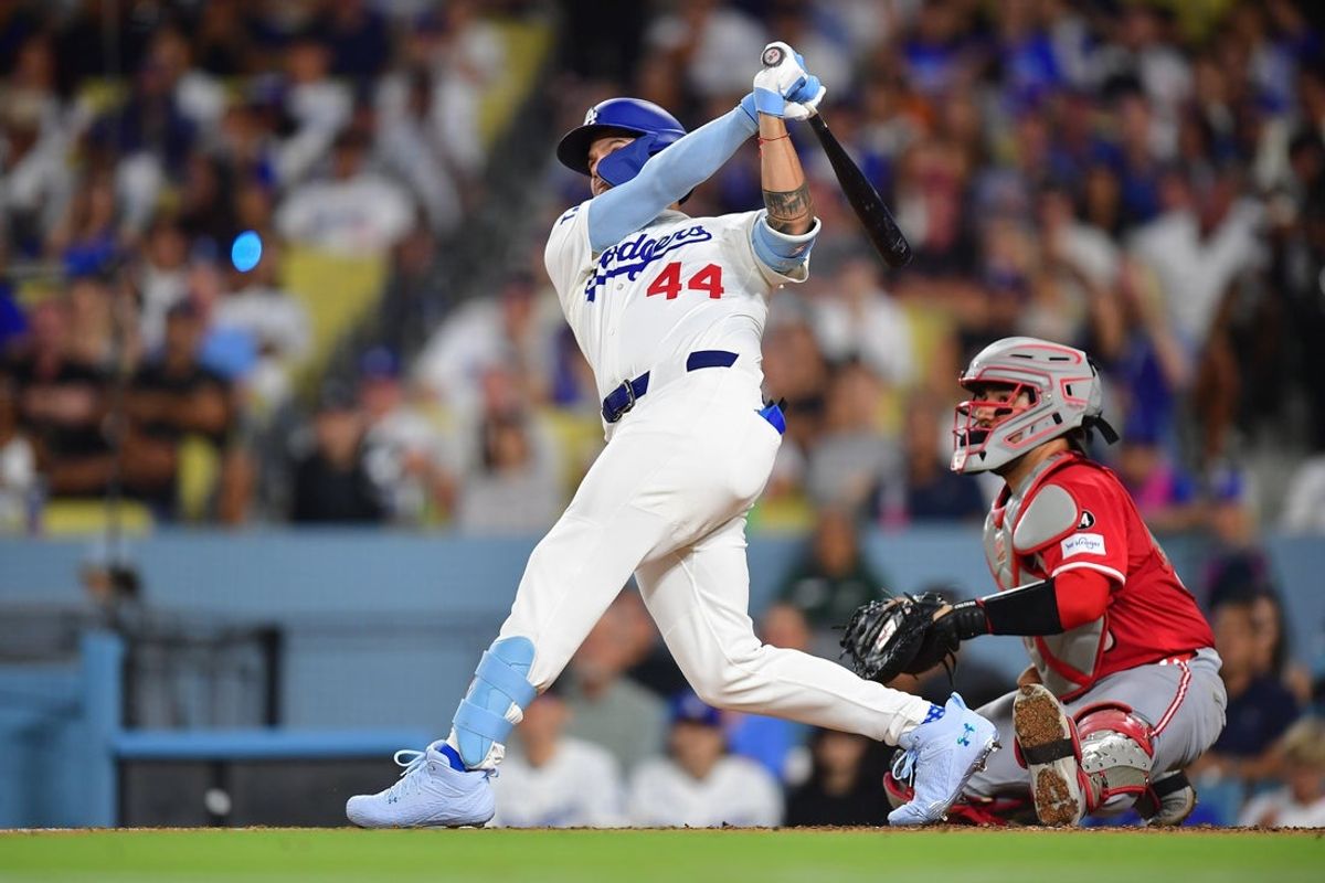 Aug 25, 2025; Los Angeles, California, USA; Los Angeles Dodgers center fielder Andy Pages (44) hits a two run home run against the Cincinnati Reds during the fifth inning at Dodger Stadium. Mandatory Credit: Gary A. Vasquez-Imagn Images