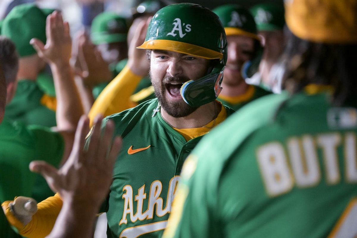 Aug 25, 2025; West Sacramento, California, USA; Athletics catcher Shea Langeliers (23) celebrates with team mates after hitting a home run against the Detroit Tigers during the seventh inning at Sutter Health Park. Mandatory Credit: Ed Szczepanski-Imagn Images
