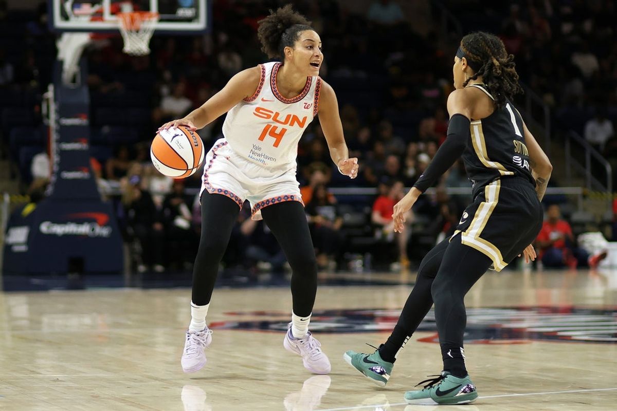 Aug 19, 2025; Washington, District of Columbia, USA; Connecticut Sun guard Bria Hartley (14) tries to slip past Washington Mystics guard Sug Sutton (1) during the second half at CareFirst Arena. Mandatory Credit: Daniel Kucin Jr.-Imagn Images