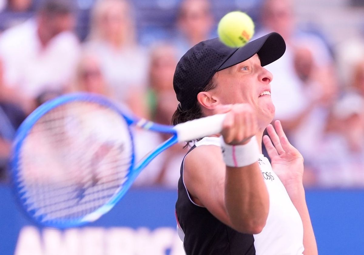 Aug 26, 2025; Flushing, NY, USA;  Iga Swiatek (POL) hits to Emiliana Arango (COL) (not pictured) on day three of the 2025 U.S. Open tennis tournament at the USTA Billie Jean King National Tennis Center. Mandatory Credit: Robert Deutsch-Imagn Images