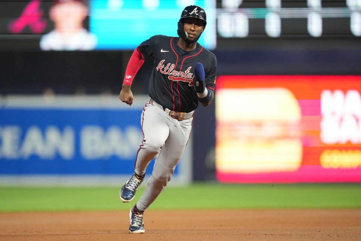 Aug 26, 2025; Miami, Florida, USA; Atlanta Braves left fielder Jurickson Profar (7) goes to third base on a base hit by Ronald Acuña Jr. in the first inning against the Miami Marlins at loanDepot Park. Mandatory Credit: Jim Rassol-Imagn Images