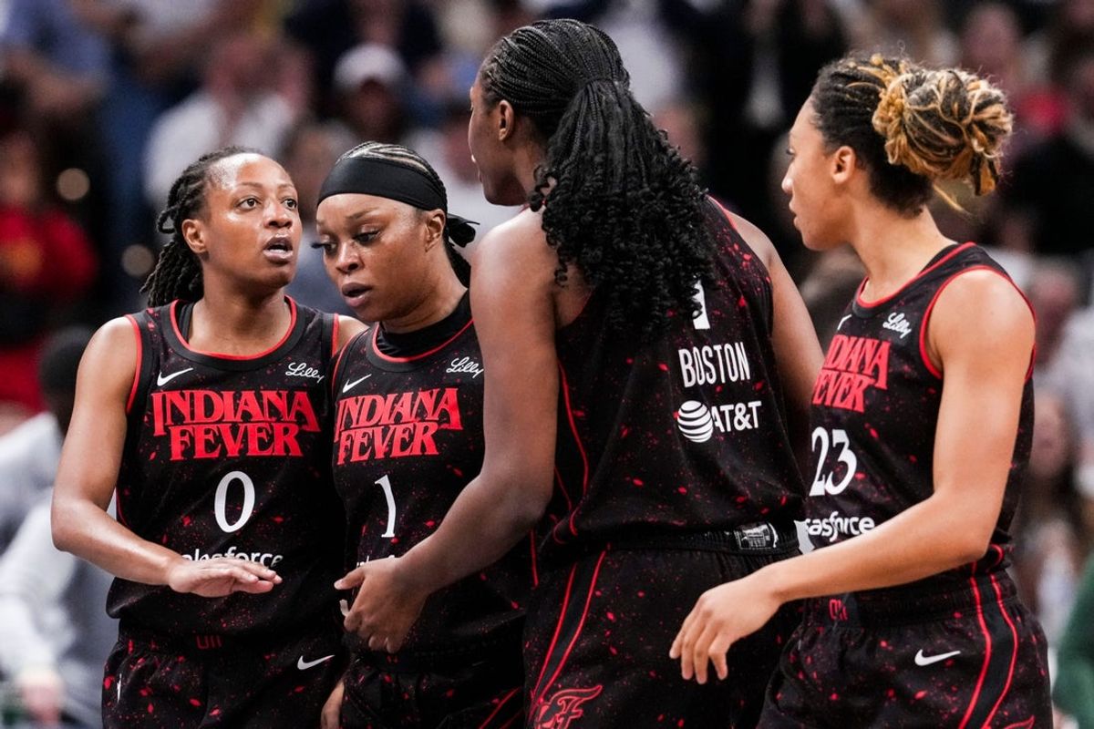 Indiana Fever guard Kelsey Mitchell (0) talks to the team Tuesday, Aug. 26, 2025, during a game between the Indiana Fever and the Seattle Storm at Gainbridge Fieldhouse in Indianapolis.