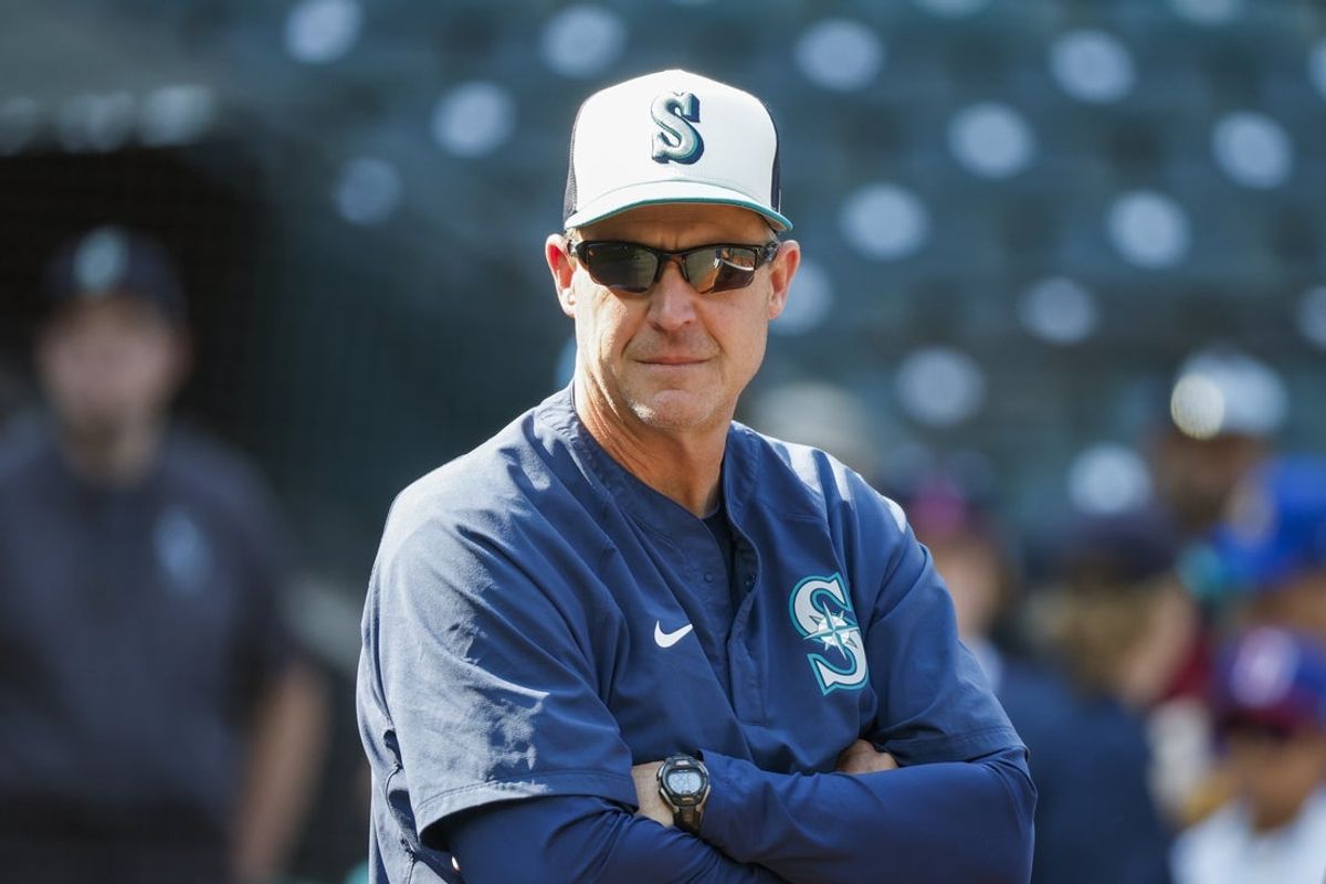 Aug 26, 2025; Seattle, Washington, USA; Seattle Mariners manager Dan Wilson (6) observes batting practice before a game against the San Diego Padres at T-Mobile Park. Mandatory Credit: Joe Nicholson-Imagn Images