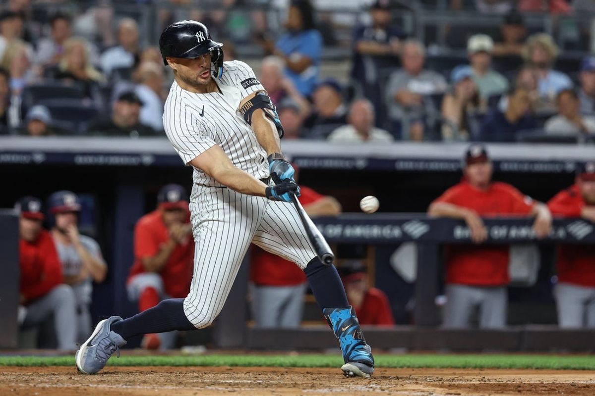 Aug 26, 2025; Bronx, New York, USA; New York Yankees right fielder Giancarlo Stanton (27) hits a two run home run in the sixth inning against the Washington Nationals at Yankee Stadium. Mandatory Credit: Wendell Cruz-Imagn Images