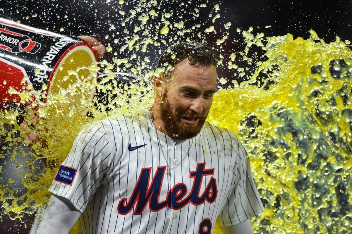 Aug 26, 2025; New York City, New York, USA; New York Mets outfielder Brandon Nimmo (9) is doused by teammates after hitting a walk off single against the Philadelphia Phillies during the ninth inning at Citi Field. Mandatory Credit: John Jones-Imagn Images