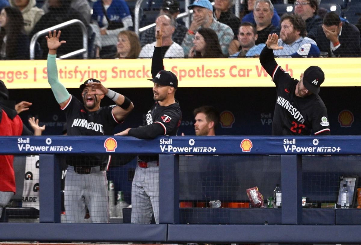 Aug 26, 2025; Toronto, Ontario, CAN;   Minnesota Twins player react after right fielder Matt Wallner (not shown) hit a three run home run against the Toronto Blue Jays in the ninth inning at Rogers Centre. Mandatory Credit: Dan Hamilton-Imagn Images