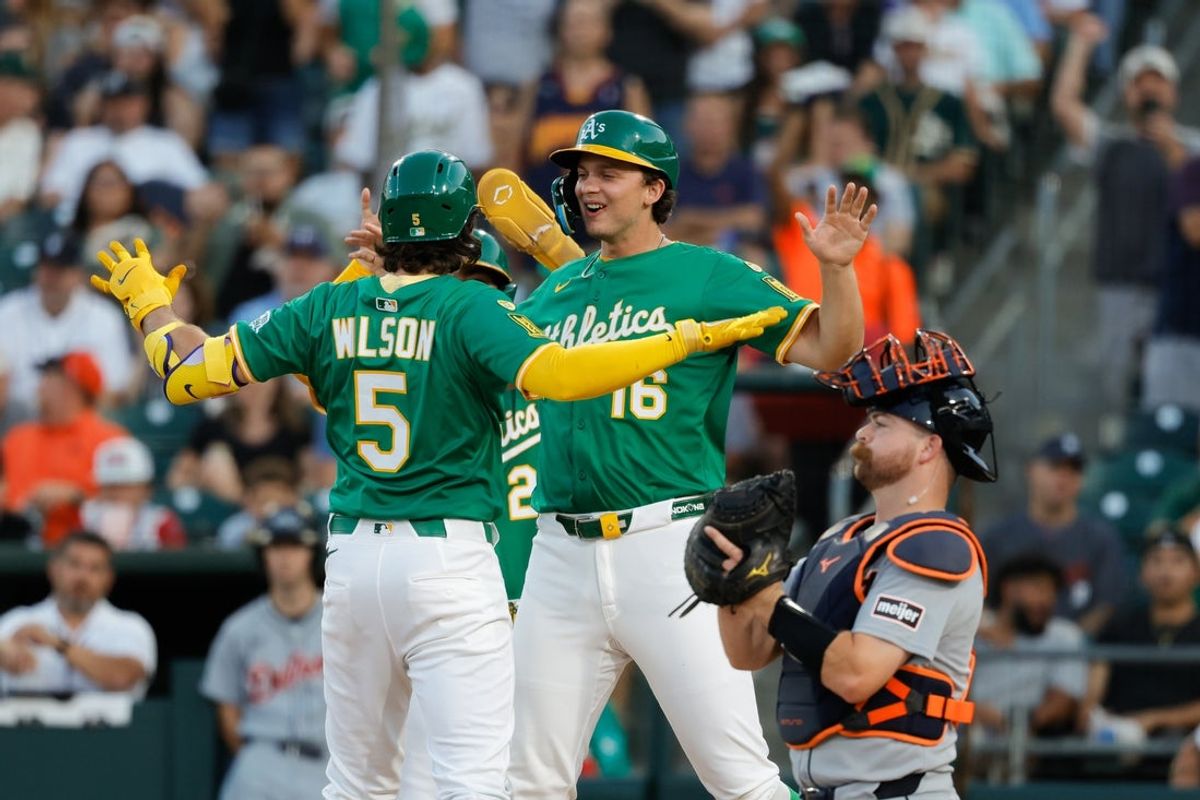 Aug 26, 2025; West Sacramento, California, USA; Athletics shortstop Jacob Wilson (5), left, celebrates with first baseman Nick Kurtz (16) at home plate after hitting a three run home run during the first inning against the Detroit Tigers at Sutter Health Park. Mandatory Credit: Sergio Estrada-Imagn Images
