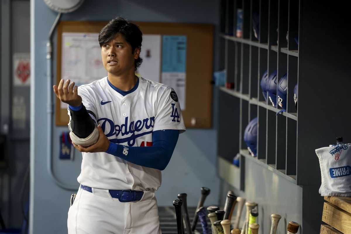 Aug 26, 2025; Los Angeles, California, USA; Los Angeles Dodgers two-way player Shohei Ohtani (17) reacts after striking out during the first inning at Dodger Stadium. Mandatory Credit: Kiyoshi Mio-Imagn Images