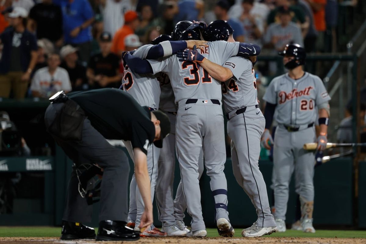 Aug 26, 2025; West Sacramento, California, USA; Detroit Tigers left fielder Riley Greene (31) hugs with teammates at home plate after hitting a grand slam home run during the third inning against the Athletics at Sutter Health Park. Mandatory Credit: Sergio Estrada-Imagn Images