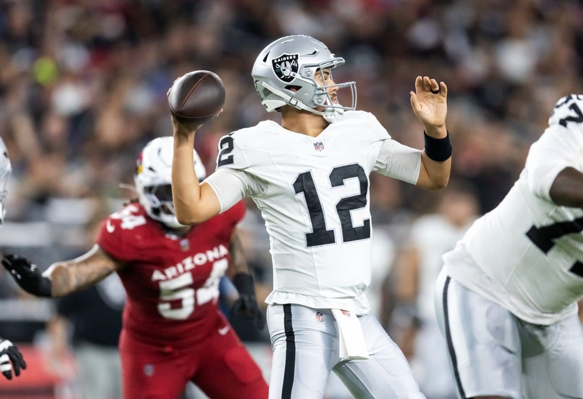 Aug 23, 2025; Glendale, Arizona, USA; Las Vegas Raiders quarterback Aidan O'Connell (12) against the Arizona Cardinals during a preseason NFL game at State Farm Stadium. Mandatory Credit: Mark J. Rebilas-Imagn Images