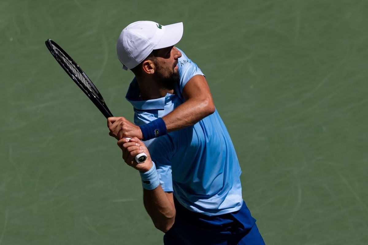 Aug 27, 2025; Flushing, NY, USA; Novak Djokovic of Serbia in action against Zachary Svajda of the United States in the second round of the menís singles at the US Open at Billie Jean King National Tennis Center. Mandatory Credit: Mike Frey-Imagn Images
