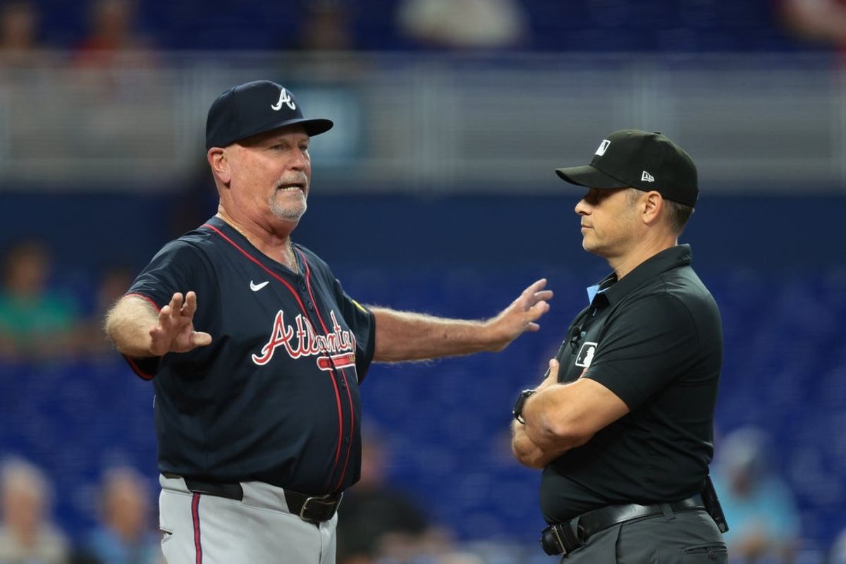Aug 27, 2025; Miami, Florida, USA; Atlanta Braves manager Brian Snitker (43) reacts after we has ejected by second base umpire Mark Wegner (14) against the Miami Marlins during the third inning at loanDepot Park. Mandatory Credit: Sam Navarro-Imagn Images