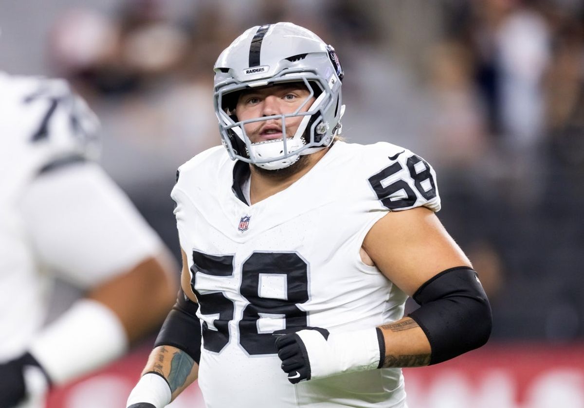 Aug 23, 2025; Glendale, Arizona, USA; Las Vegas Raiders lineman Jackson Powers-Johnson (58) against the Arizona Cardinals during a preseason NFL game at State Farm Stadium. Mandatory Credit: Mark J. Rebilas-Imagn Images